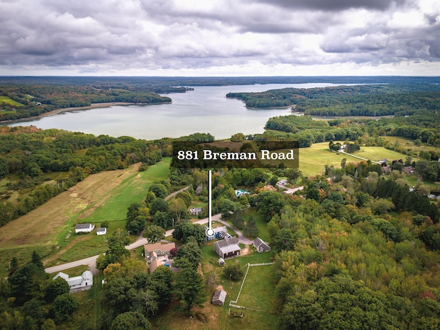 birds eye view of property featuring a water view