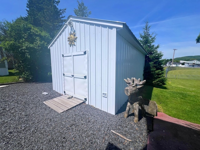 view of outdoor structure with a yard