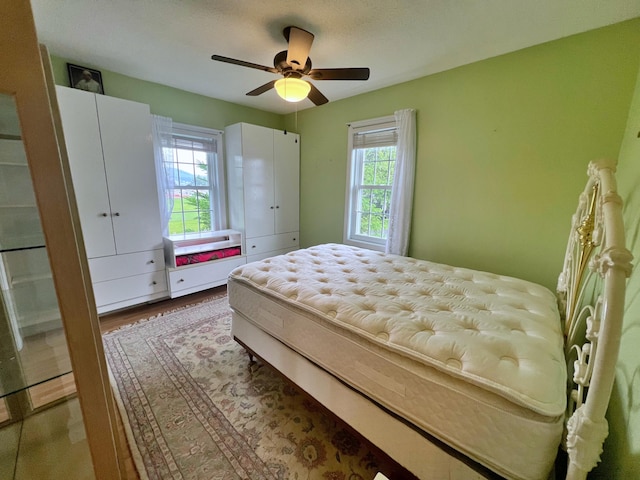 bedroom featuring wood-type flooring and ceiling fan