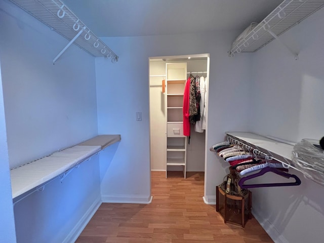 walk in closet featuring hardwood / wood-style flooring