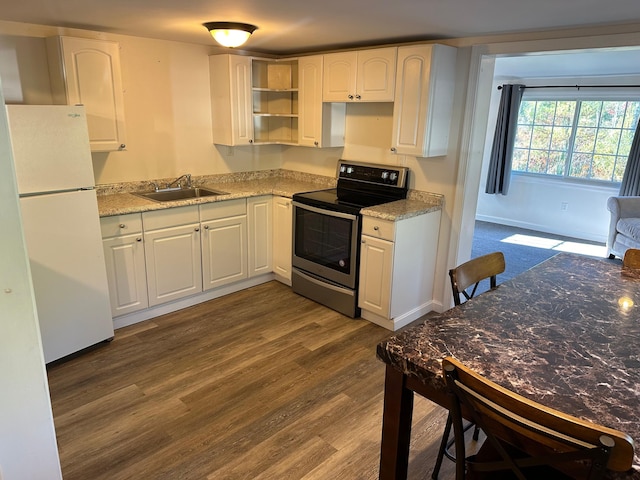 kitchen featuring dark wood-type flooring, white cabinets, white refrigerator, sink, and electric range