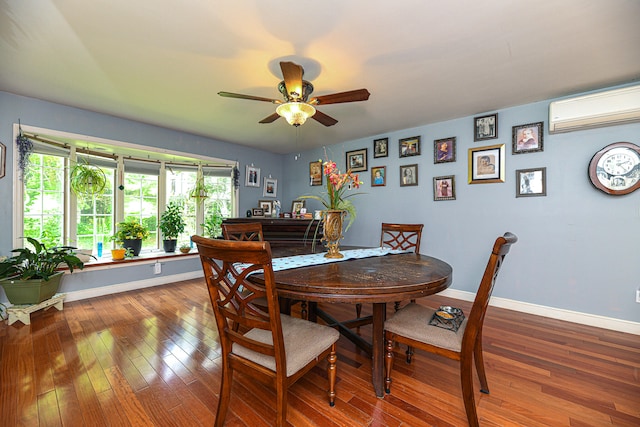 dining space with wood-type flooring, a wall mounted AC, and ceiling fan