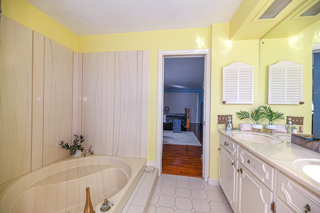 bathroom featuring a tub to relax in and vanity