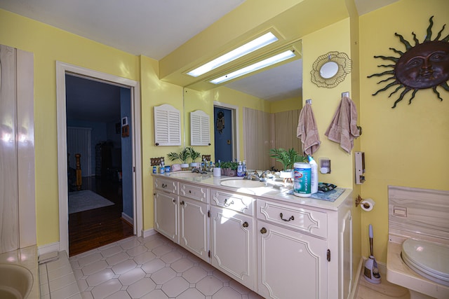 bathroom with tile patterned floors and vanity