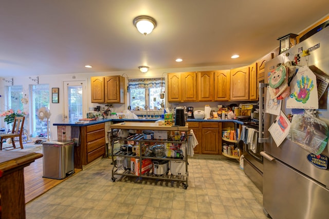 kitchen featuring appliances with stainless steel finishes, sink, and a center island