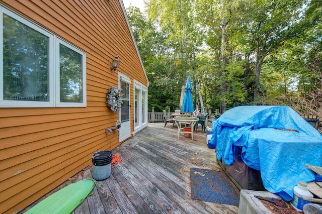 wooden deck featuring area for grilling