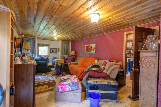 living room with wood ceiling and light hardwood / wood-style floors