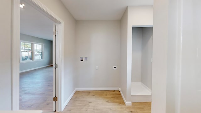 laundry area featuring hookup for a washing machine, light hardwood / wood-style flooring, and electric dryer hookup