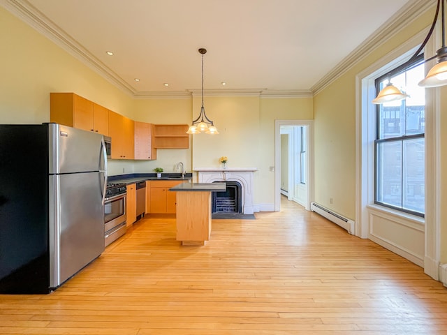 kitchen with light hardwood / wood-style flooring, a baseboard radiator, stainless steel appliances, and an island with sink