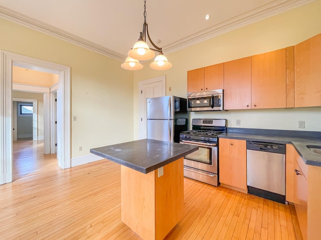 kitchen with light wood-type flooring, a center island, stainless steel appliances, crown molding, and a kitchen bar