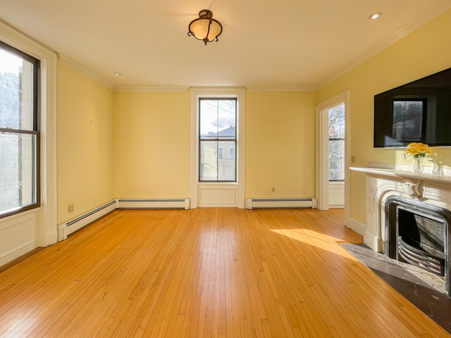 unfurnished living room with ornamental molding, light wood-type flooring, and baseboard heating