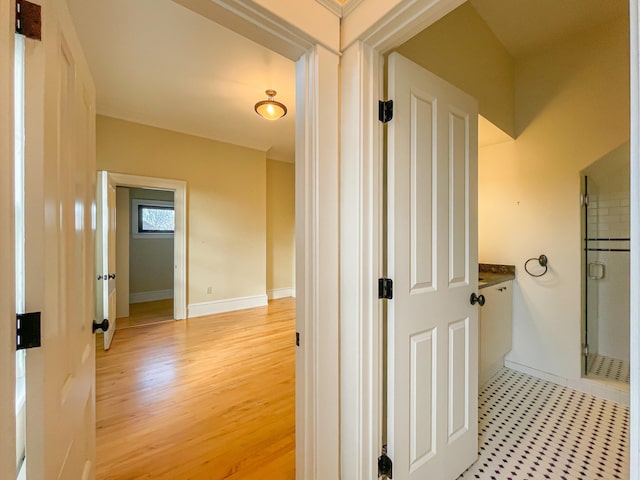 hallway with light hardwood / wood-style flooring