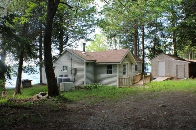 exterior space with a shed