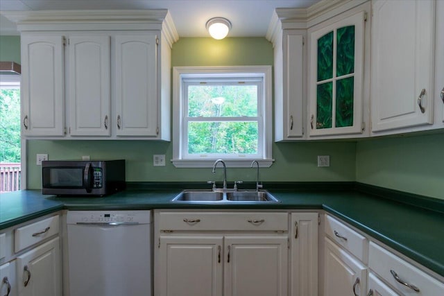 kitchen with dishwasher, sink, and white cabinetry