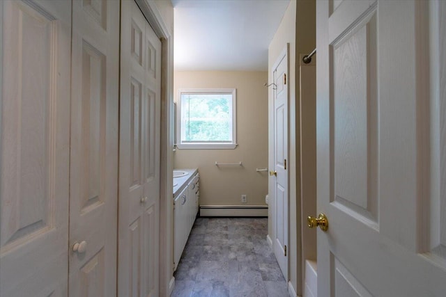 bathroom with vanity, toilet, and a baseboard radiator