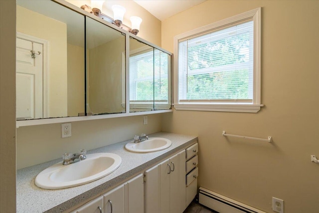 bathroom featuring vanity and baseboard heating