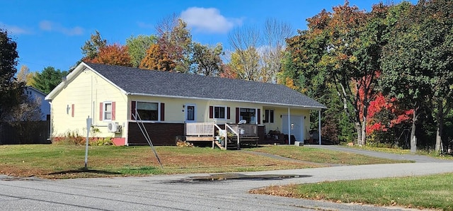 60 Elm St, East Millinocket, ME 04430 - ranch-style home featuring covered porch, a front lawn, and driveway