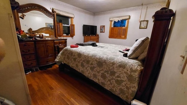 bedroom with wood-type flooring