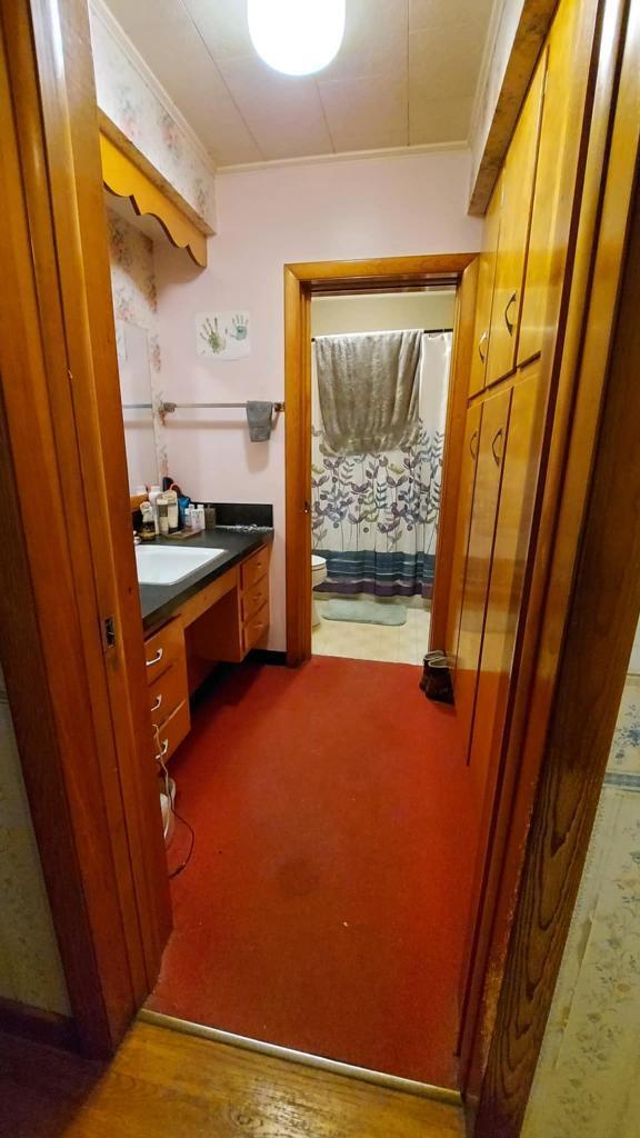 60 Elm St, East Millinocket, ME 04430 - full bathroom with vanity and ornamental molding