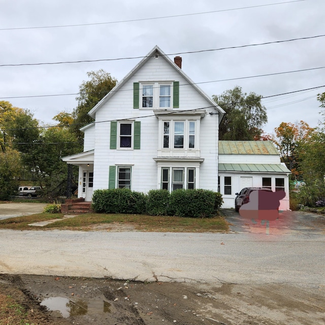 view of front of property featuring a chimney