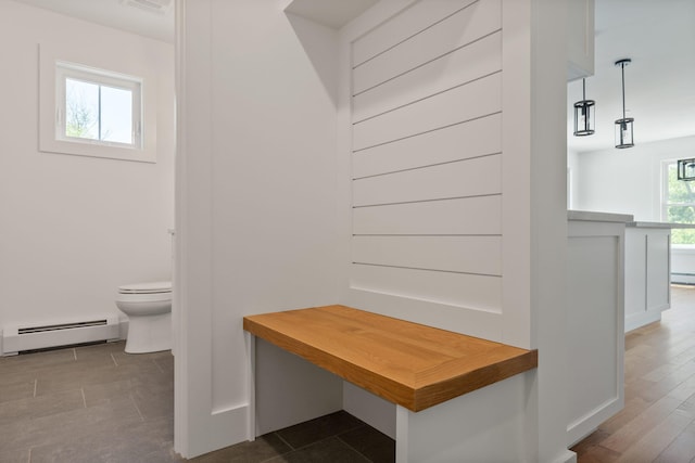 mudroom featuring a baseboard radiator and dark hardwood / wood-style floors