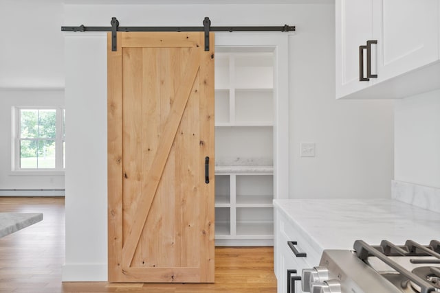 761 Fort Hill Rd, Gorham, ME 04038 - mudroom with light wood-style flooring, a baseboard heating unit, and a barn door