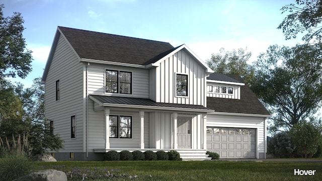 761 Fort Hill Rd, Gorham, ME 04038 - view of front of home with board and batten siding, a front yard, a shingled roof, and a garage