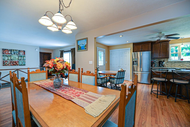 832 College St, Lewiston, ME 04240 - dining room with plenty of natural light, light wood finished floors, a chandelier, a ceiling fan, and recessed lighting