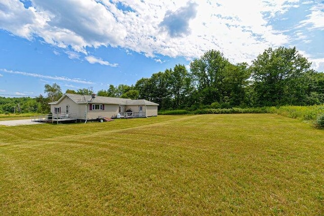 832 College St, Lewiston, ME 04240 - view of green lawn with a deck