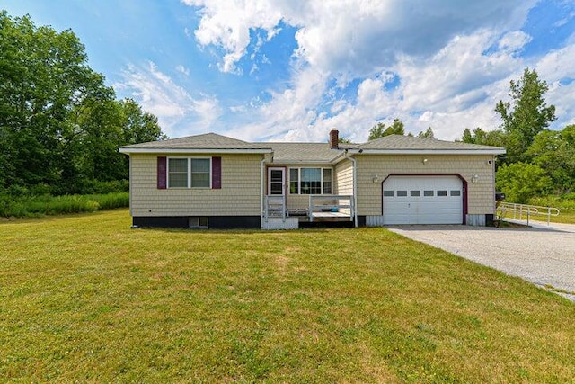 ranch-style home featuring a front lawn and a garage