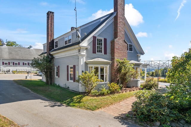 view of side of home featuring a yard