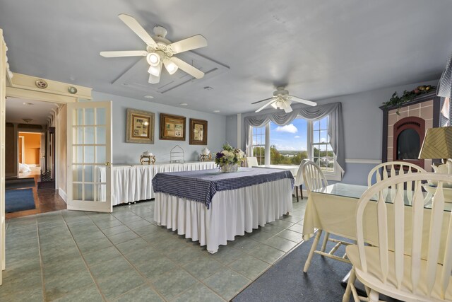 tiled bedroom with ceiling fan