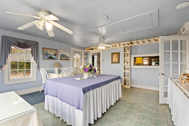 interior space featuring ceiling fan and tile patterned floors