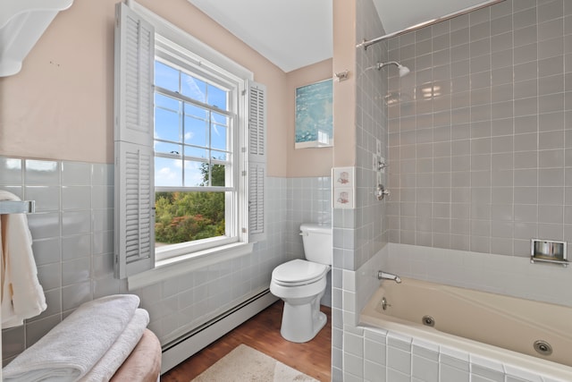 bathroom with baseboard heating, wood-type flooring, toilet, and a healthy amount of sunlight