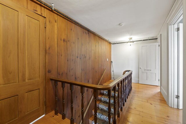 hallway with light hardwood / wood-style flooring