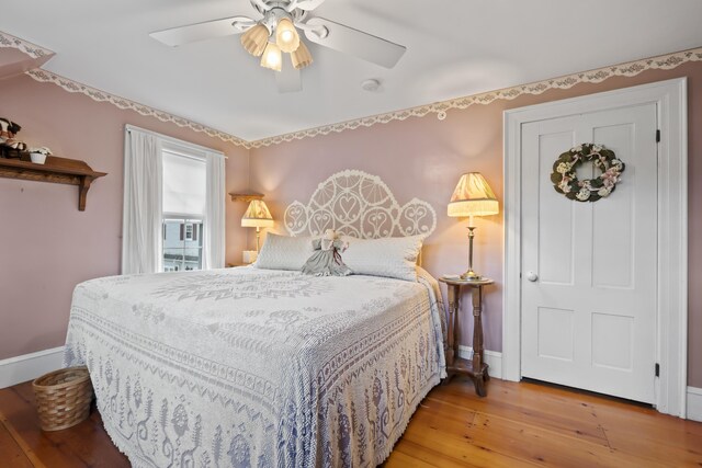 bedroom featuring ceiling fan and light hardwood / wood-style flooring