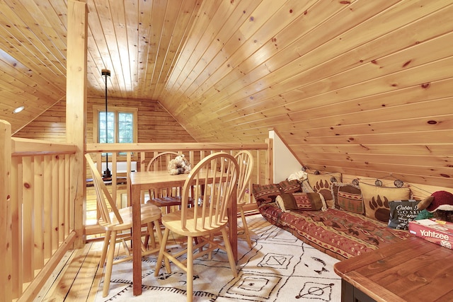 interior space featuring wooden walls, wood ceiling, and vaulted ceiling