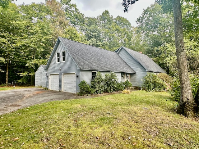 view of property exterior featuring a lawn and a garage