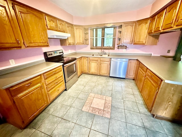 kitchen with sink, light tile patterned floors, and stainless steel appliances