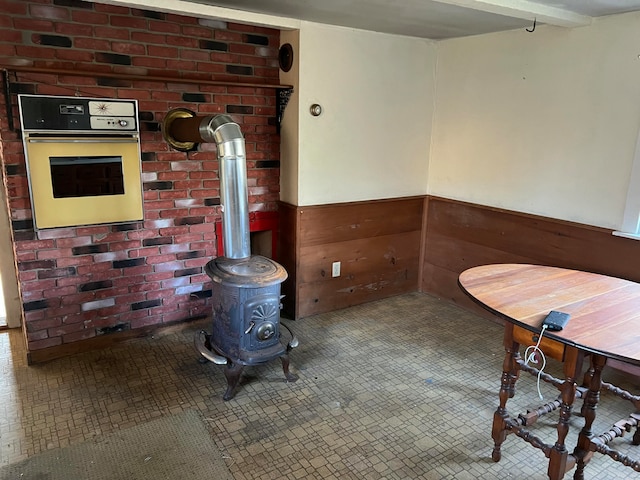 dining room with a wood stove