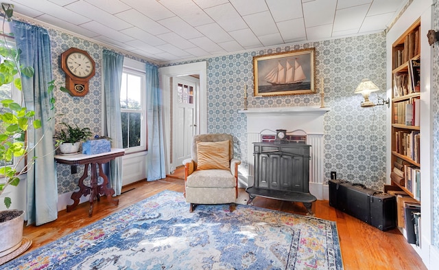 1276 State Route 32, Bristol, ME 04564 - sitting room with wallpapered walls, ornamental molding, and wood finished floors