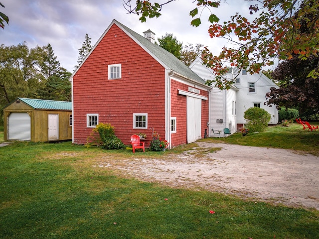 1276 State Route 32, Bristol, ME 04564 - exterior space featuring roof with shingles, a yard, a garage, and an outdoor structure