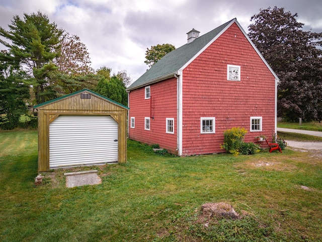 1276 State Route 32, Bristol, ME 04564 - view of home's exterior with a lawn, roof with shingles, an outbuilding, and a detached garage
