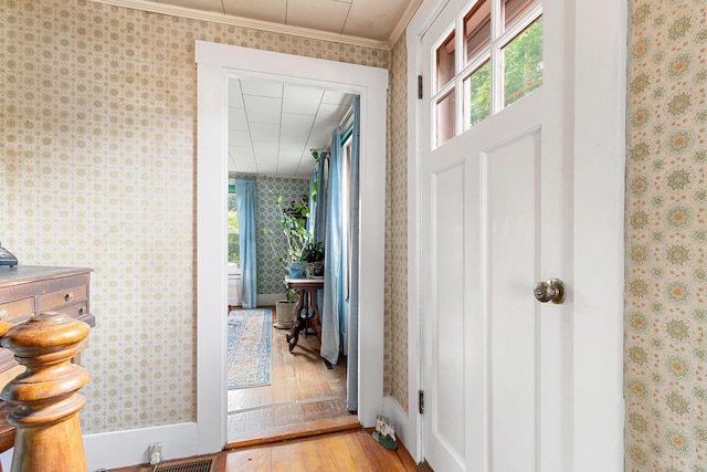 1276 State Route 32, Bristol, ME 04564 - entryway with wallpapered walls, baseboards, hardwood / wood-style floors, and crown molding