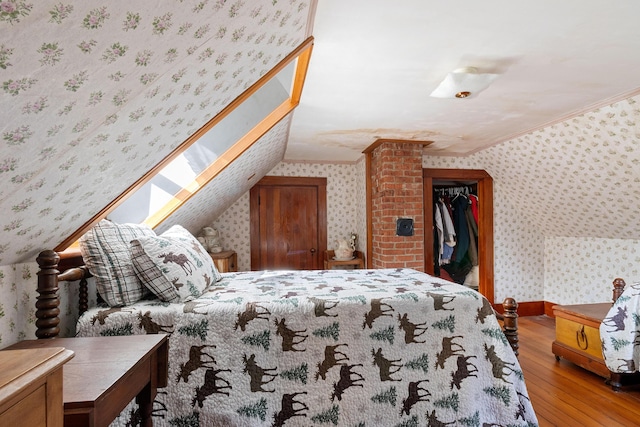 1276 State Route 32, Bristol, ME 04564 - bedroom featuring wallpapered walls, hardwood / wood-style floors, baseboards, and ornamental molding