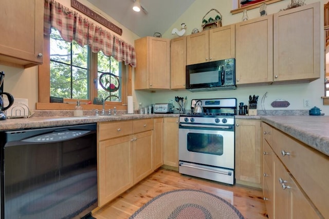 kitchen featuring light hardwood / wood-style floors, sink, vaulted ceiling, black appliances, and light brown cabinets