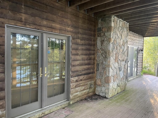 entrance to property featuring french doors and a deck