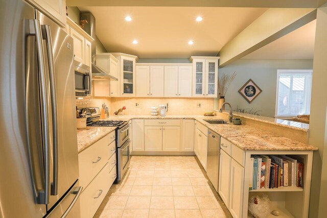 124 Collette Rd, Holden, ME 04429 - kitchen featuring stainless steel appliances, a sink, a peninsula, decorative backsplash, and light tile patterned floors