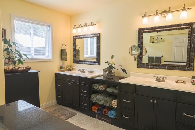 124 Collette Rd, Holden, ME 04429 - full bath with vanity, tile patterned flooring, and baseboards