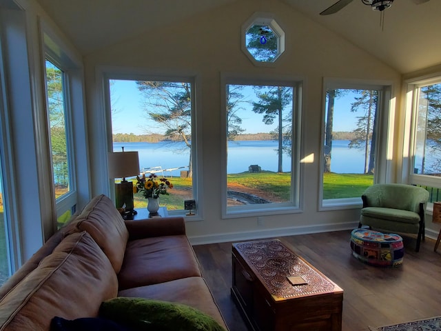 sunroom featuring a water view and a healthy amount of sunlight